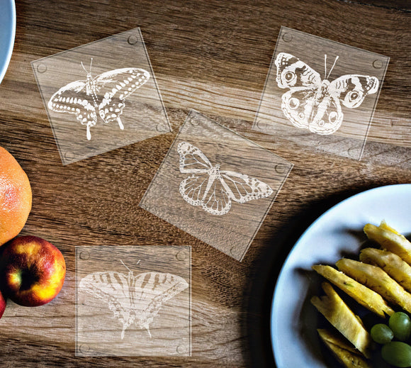 Hand etched glass coasters, butterfly designs: Monarch, Black Swallowtail, Tiger Swallowtail, and Common Buckeye.  Eye catching and elegant coasters! - Inspired Passion Productions