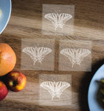 Hand etched glass coasters, butterfly designs: Monarch, Black Swallowtail, Tiger Swallowtail, and Common Buckeye.  Eye catching and elegant coasters! - Inspired Passion Productions